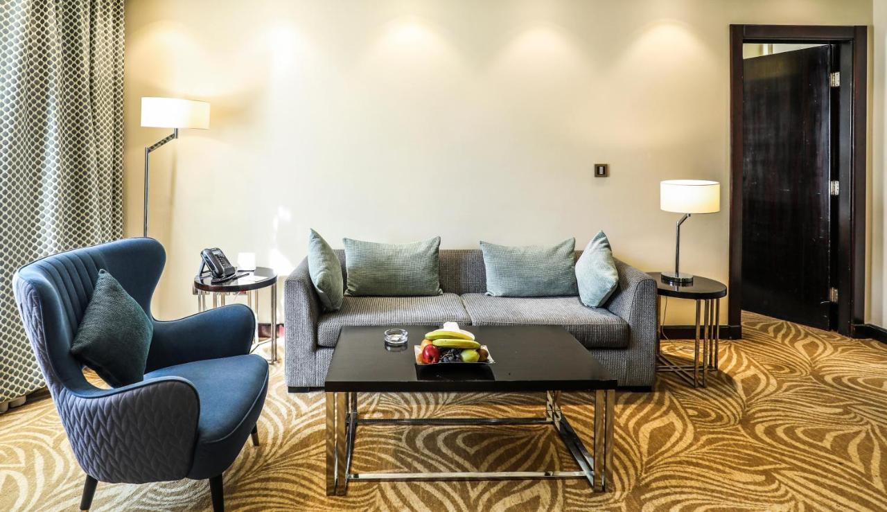 Triumph Luxury Hotel Cairo Exterior photo A living room in a suite at the hotel