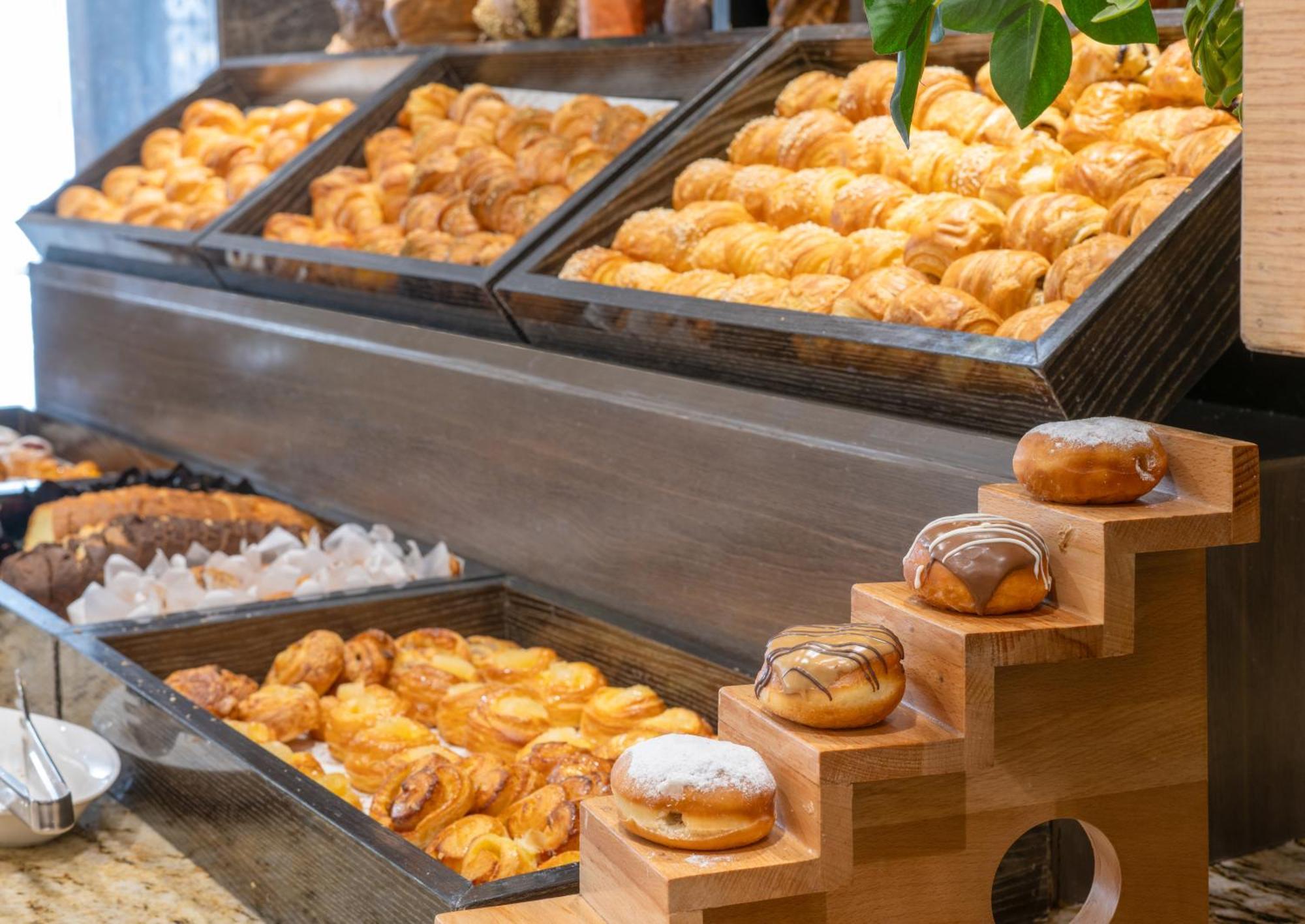 Triumph Luxury Hotel Cairo Exterior photo Croissants and other pastries at a buffet