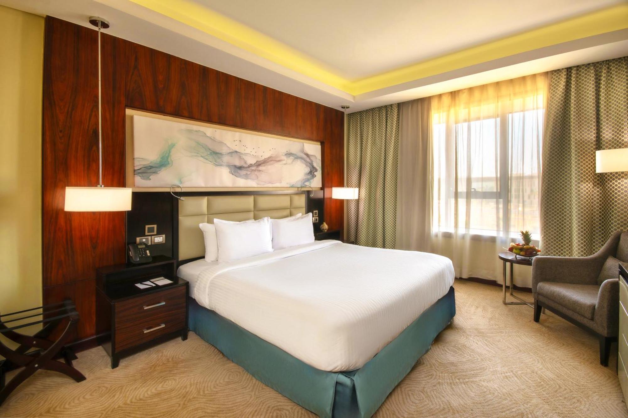 Triumph Luxury Hotel Cairo Room photo A bedroom at the hotel