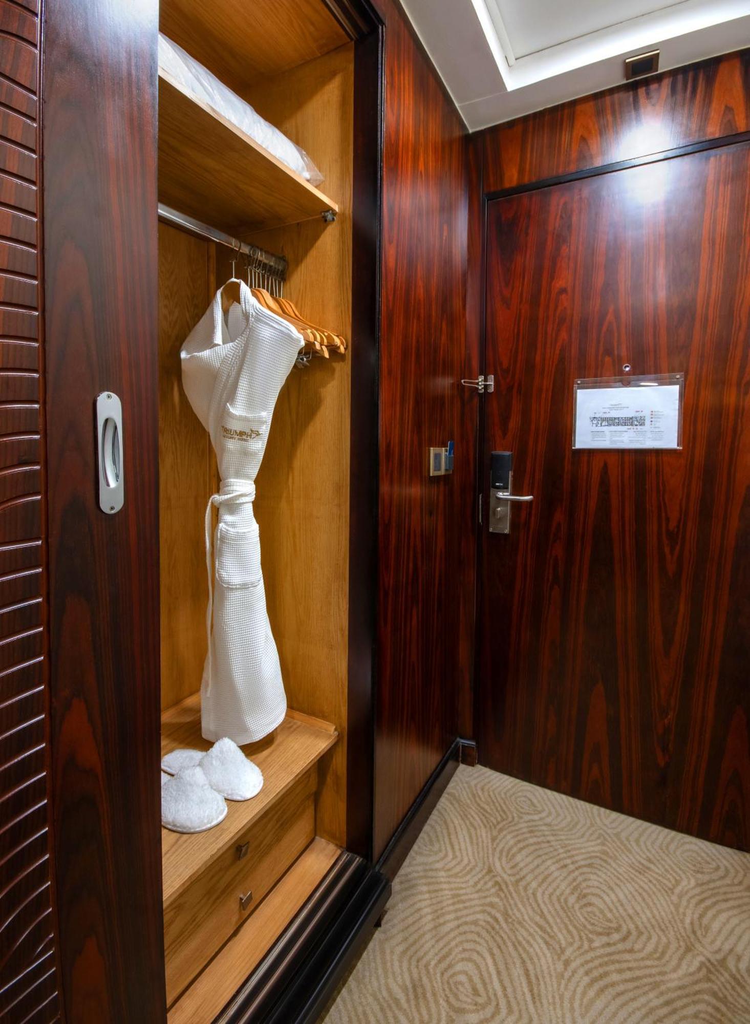 Triumph Luxury Hotel Cairo Room photo A hotel room in the Emirates First Class lounge at Dubai International Airport